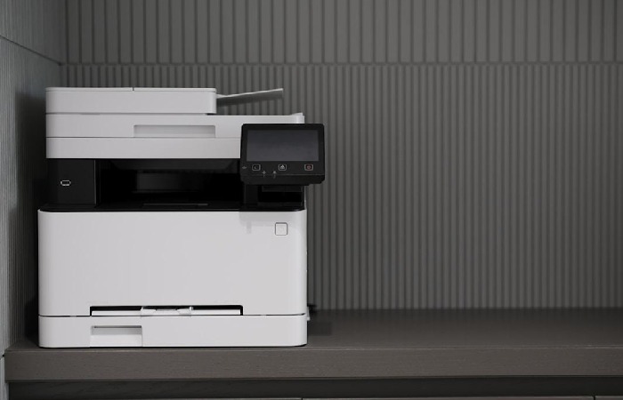 A printer on a desk, designed for sending and receiving online faxes.